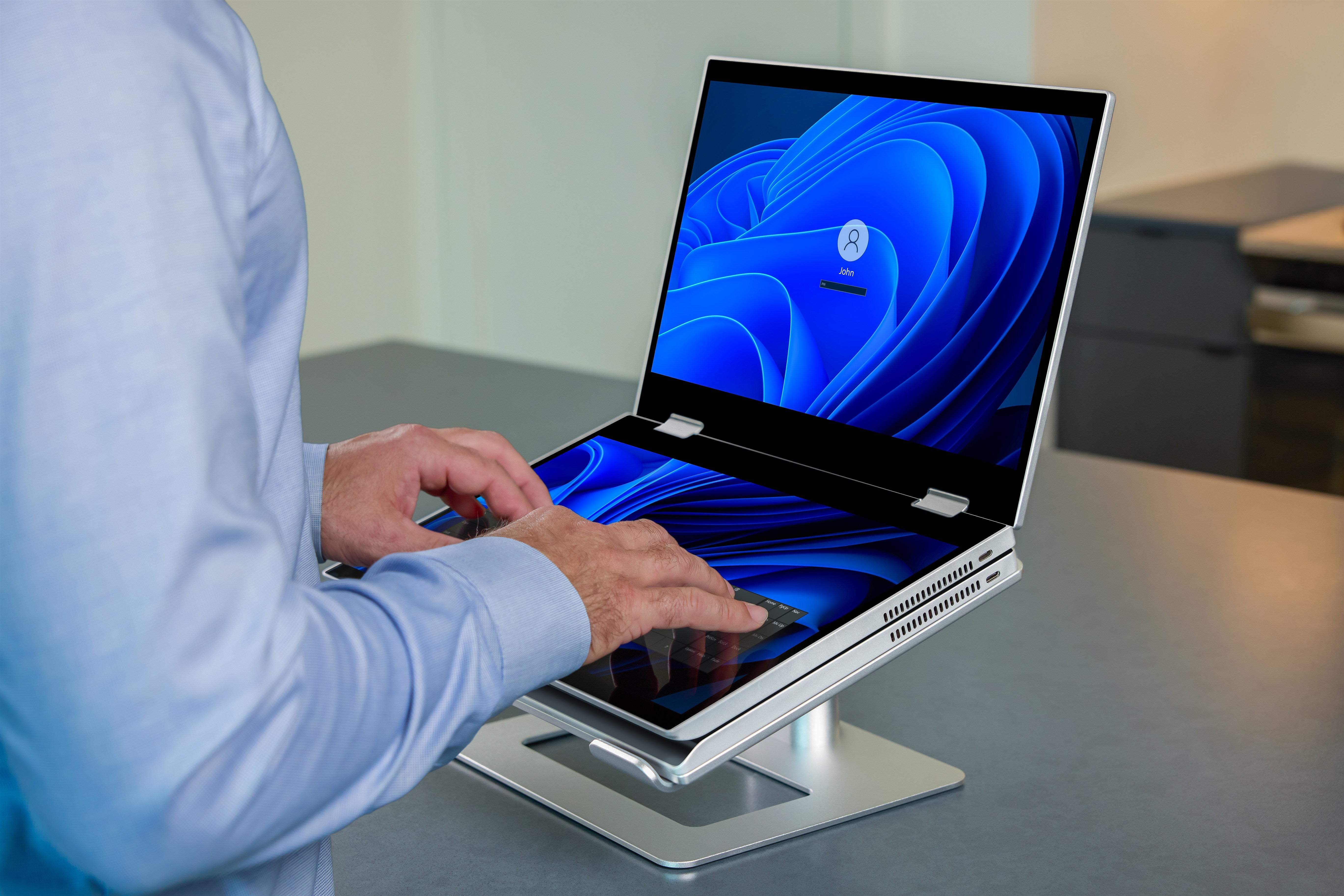 Hands using XbooK touchscreen